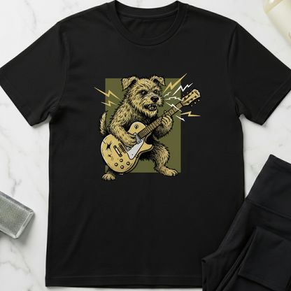 Black t-shirt with a dog playing guitar graphic on a white marble surface. Minimalist dog apparel by pemuyo.