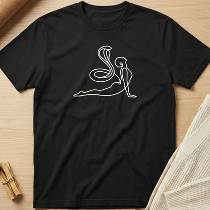 Black t-shirt with white line art design on a wooden surface. Minimalist yoga apparel by pemuyo.
