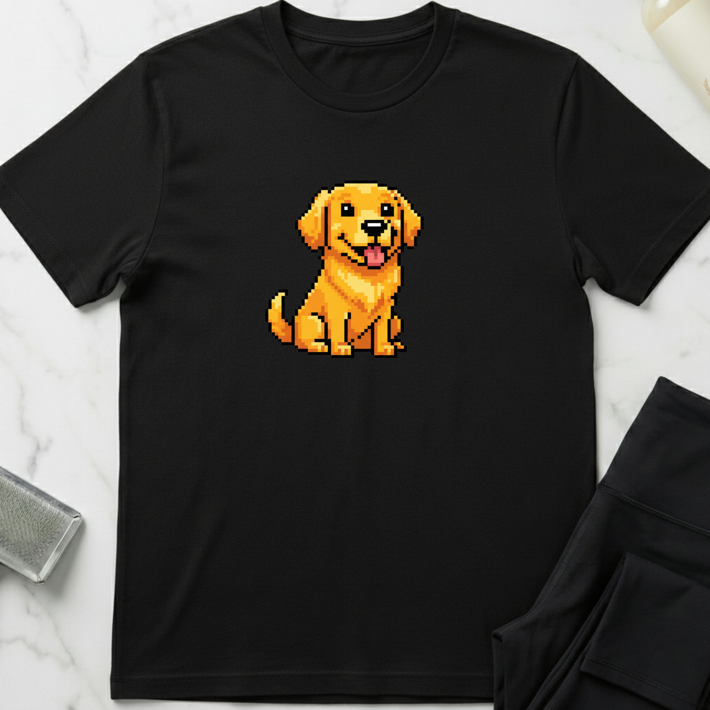 Black t-shirt with a pixelated dog graphic on a marble surface. Minimalist dog apparel by pemuyo.