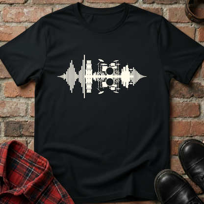 Black t-shirt with white drum pattern design on a brick background. Minimalist music apparel by pemuyo.