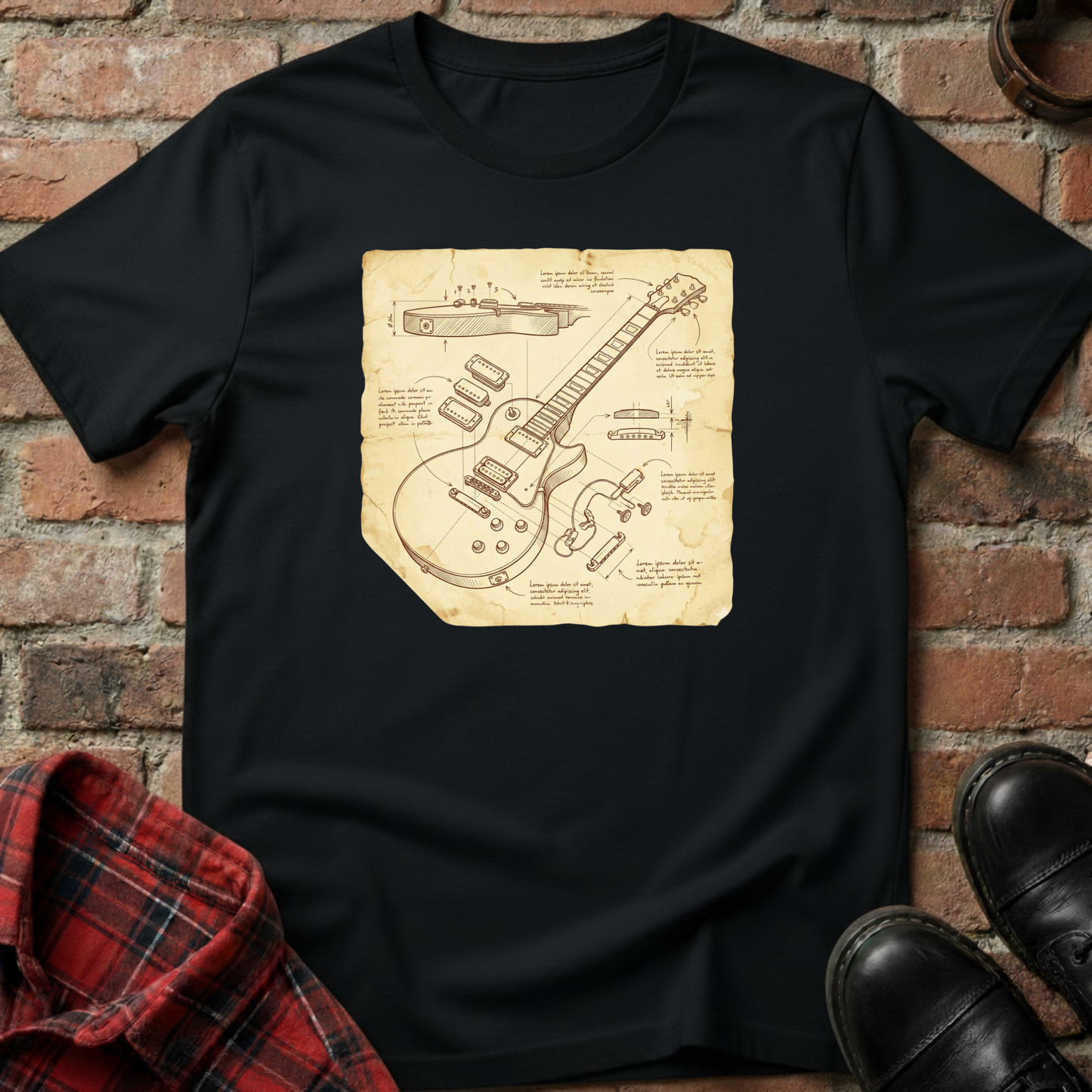 Black t-shirt with guitar blueprint design on a brick background. Minimalist music apparel by pemuyo.
