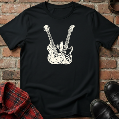 Black t-shirt with white guitar design on a brick background. Minimalist music apparel by pemuyo.