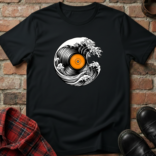 Black t-shirt with vinyl record design on a brick wall background. Minimalist music apparel by pemuyo.