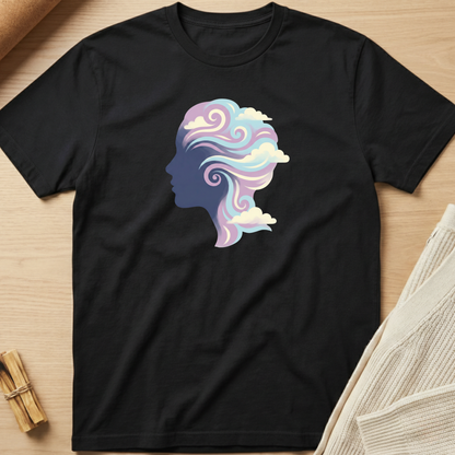Black t-shirt with a colorful silhouette design of a head on a wooden surface. Minimalist yoga apparel by pemuyo.