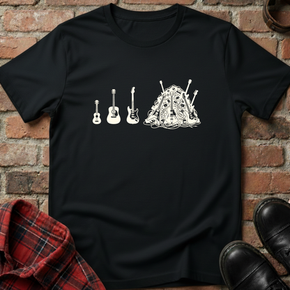 Black t-shirt with white graphic design of guitars and a drum on a brick wall background. Minimalist music apparel by pemuyo.