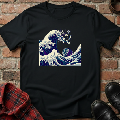 Black t-shirt with a wave and fish design on a brick wall background. Minimalist music apparel by pemuyo.