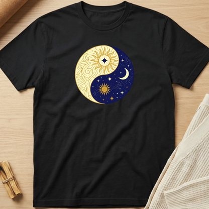 Black t-shirt with a sun and moon design on a wooden surface. Minimalist yoga apparel by pemuyo.
