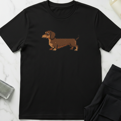 Black t-shirt with a brown dachshund graphic on a white marble surface. Minimalist dog apparel by pemuyo.