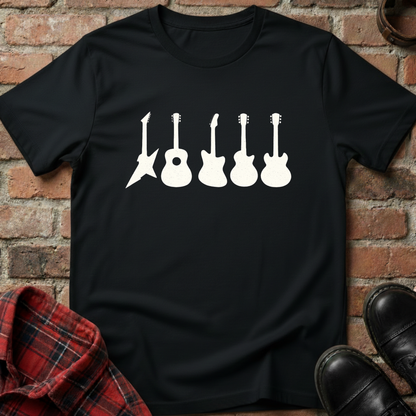 Black t-shirt with white guitar graphic on a brick wall background. Minimalist music apparel by pemuyo.