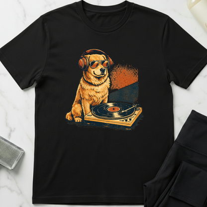 Black t-shirt with a graphic of a dog on a turntable and headphones, placed on a marble surface. Minimalist dog apparel by pemuyo.