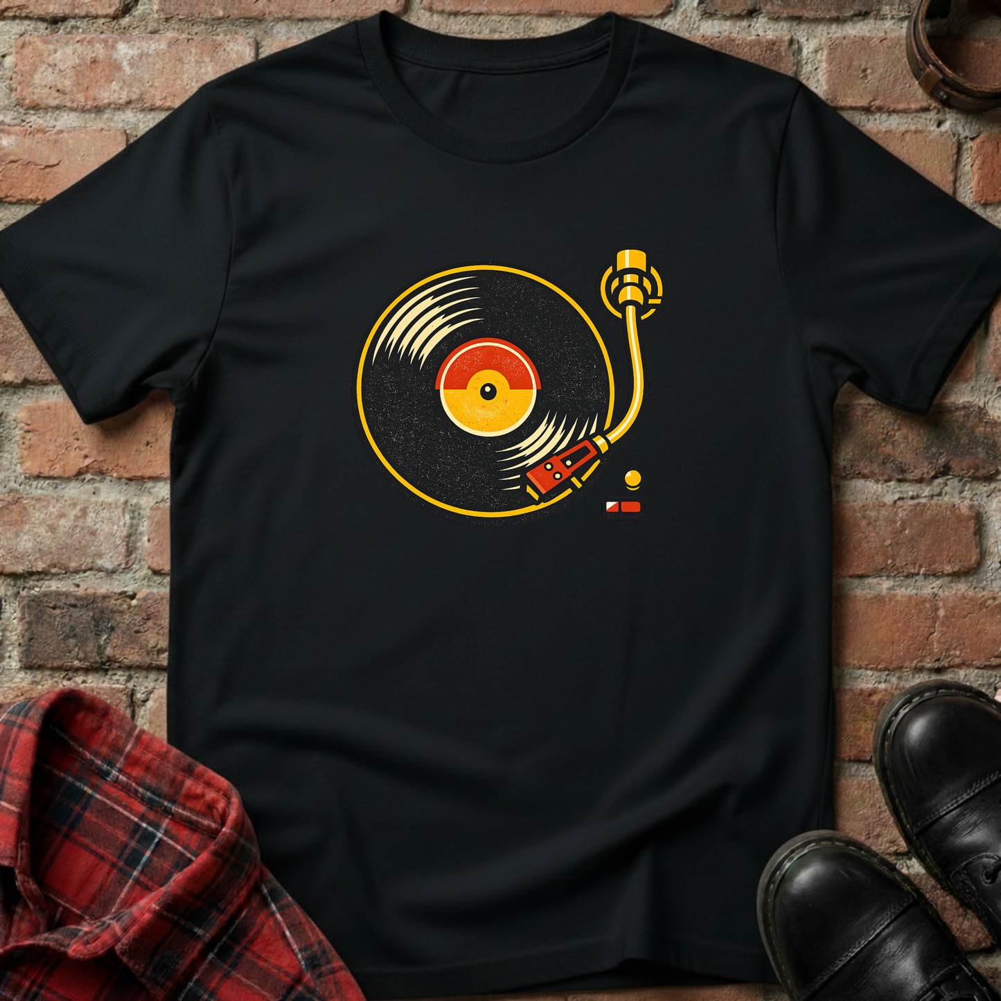 Black t-shirt with vinyl record design on a brick wall background. Minimalist music apparel by pemuyo.