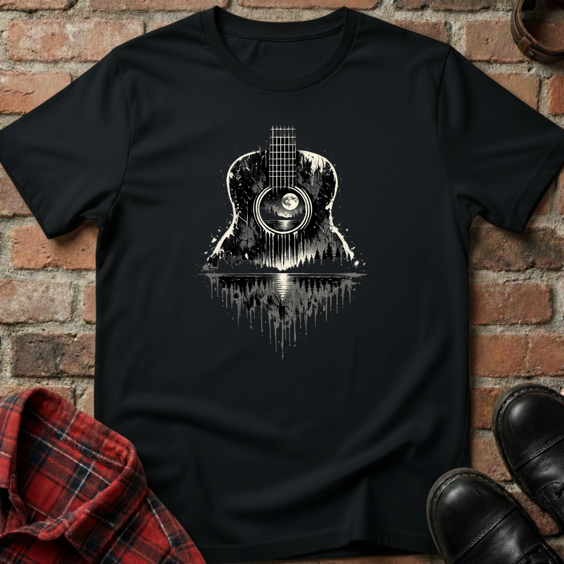 Black t-shirt with guitar graphic on a brick wall background. Minimalist music apparel by pemuyo.