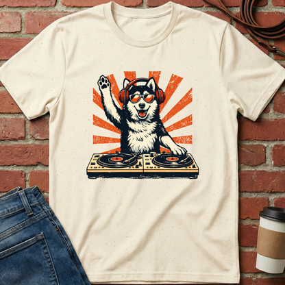 Beige t-shirt with a graphic of a dog on turntables against a brick wall. Minimalist dog apparel by pemuyo.