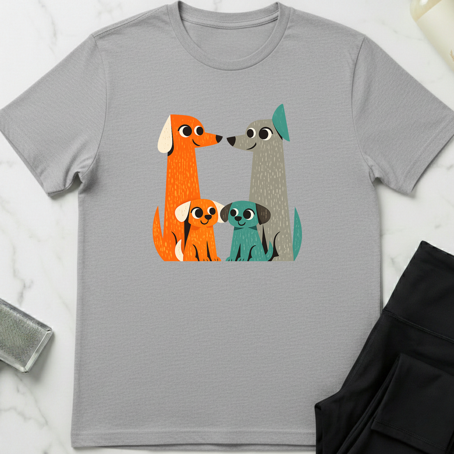 Gray t-shirt with colorful dog illustration on a white marble surface. Minimalist dog apparel by pemuyo.