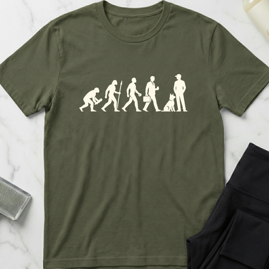 Green t-shirt with white graphic design on a marble surface. Minimalist dog apparel by pemuyo.