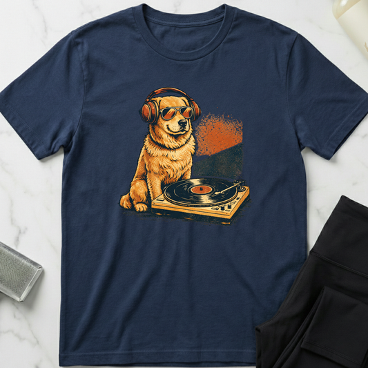 Navy blue t-shirt with a graphic of a dog on a turntable and headphones, placed on a marble surface. Minimalist dog apparel by pemuyo.
