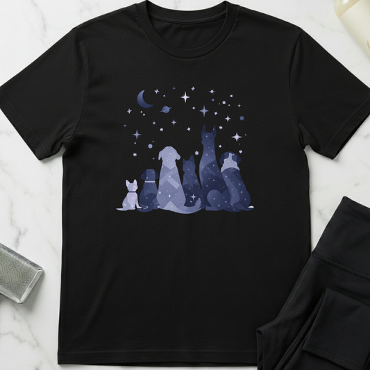Black t-shirt with a graphic of dogs under a moon and stars on a marble surface. Minimalist dog apparel by pemuyo.
