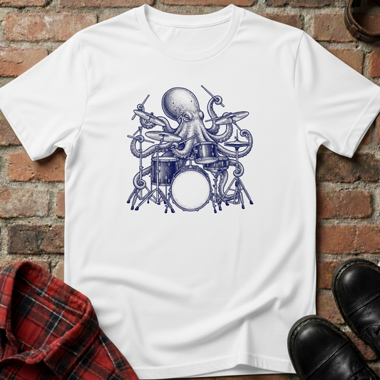 White t-shirt with an octopus playing drums graphic on a brick surface. Minimalist music apparel by pemuyo.