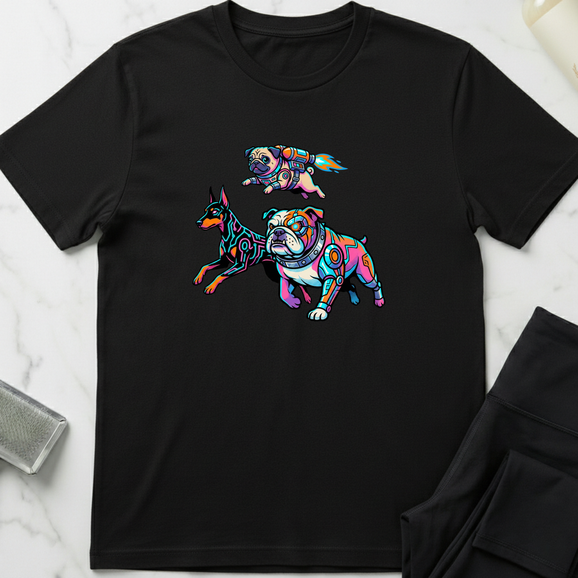 Black t-shirt with colorful dog illustrations on a marble surface. Minimalist dog apparel by pemuyo.