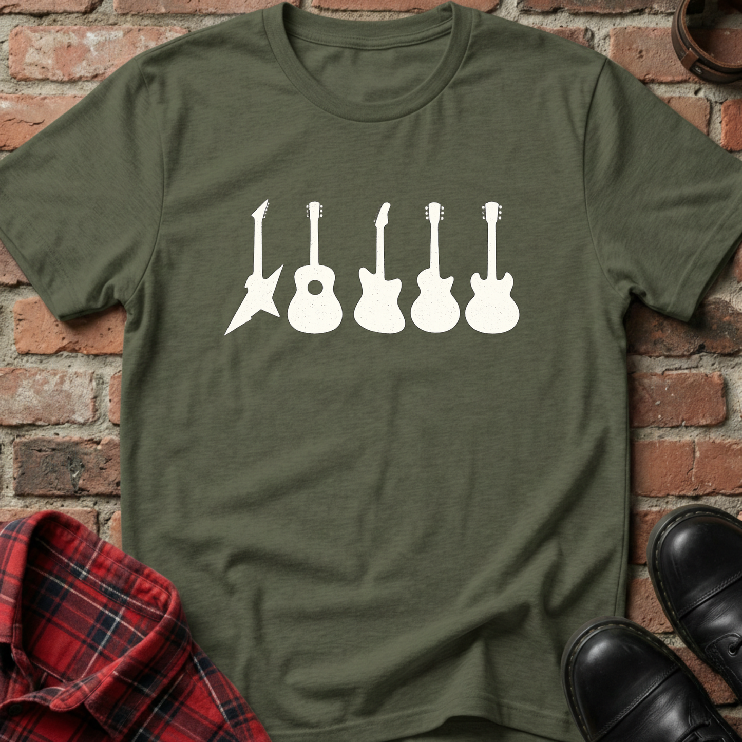 Green t-shirt with white guitar graphic on a brick background. Minimalist music apparel by pemuyo.