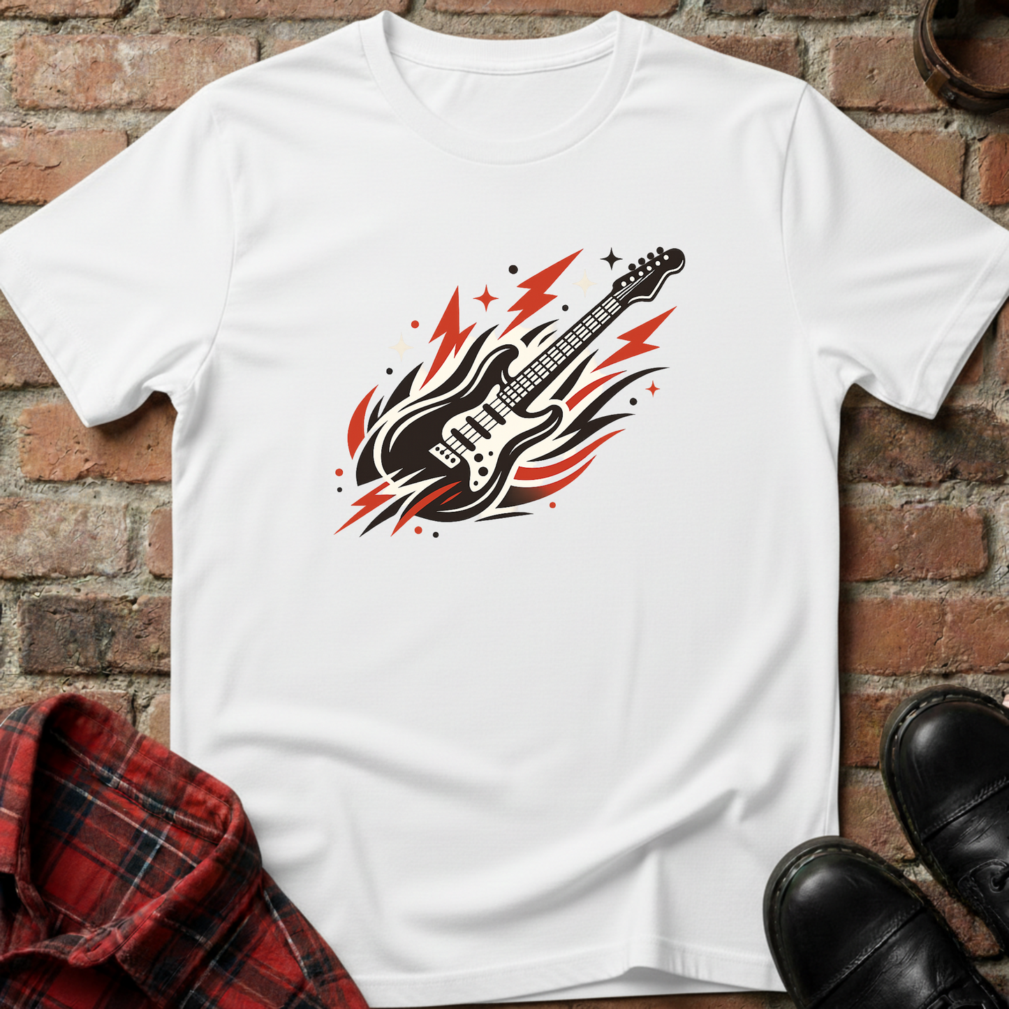 White t-shirt with a guitar graphic on a brick surface. Minimalist music apparel by pemuyo.