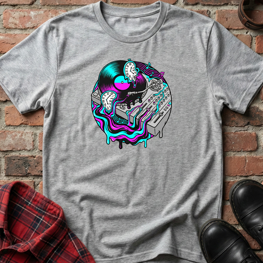 Gray t-shirt with a colorful graphic design on a brick surface. Minimalist music apparel by pemuyo.