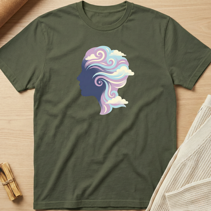 Green t-shirt with a colorful graphic of a face on a wooden surface. Minimalist yoga apparel by pemuyo.