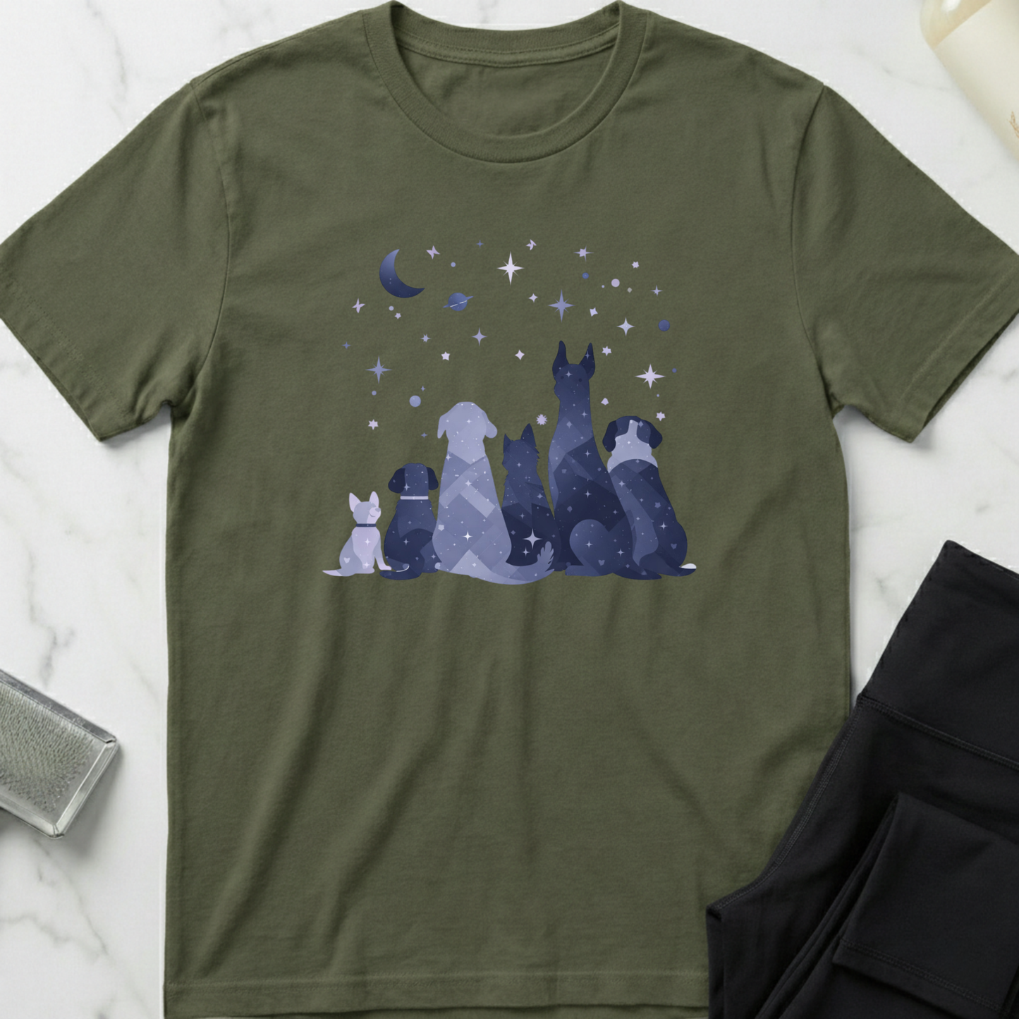 Green t-shirt with dog illustration and starry night design on a marble surface. Minimalist dog apparel by pemuyo.