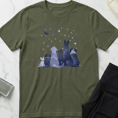 Green t-shirt with dog illustration and starry night design on a marble surface. Minimalist dog apparel by pemuyo.