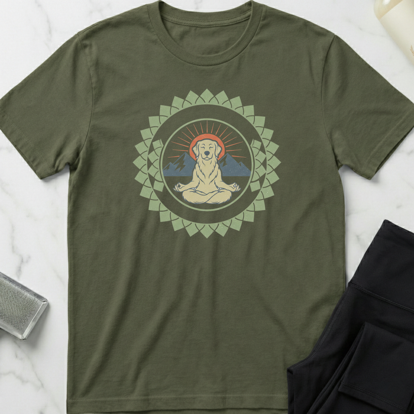 Green t-shirt with a graphic design of a meditating figure in a mandala on a marble surface. Minimalist yoga apparel by pemuyo.