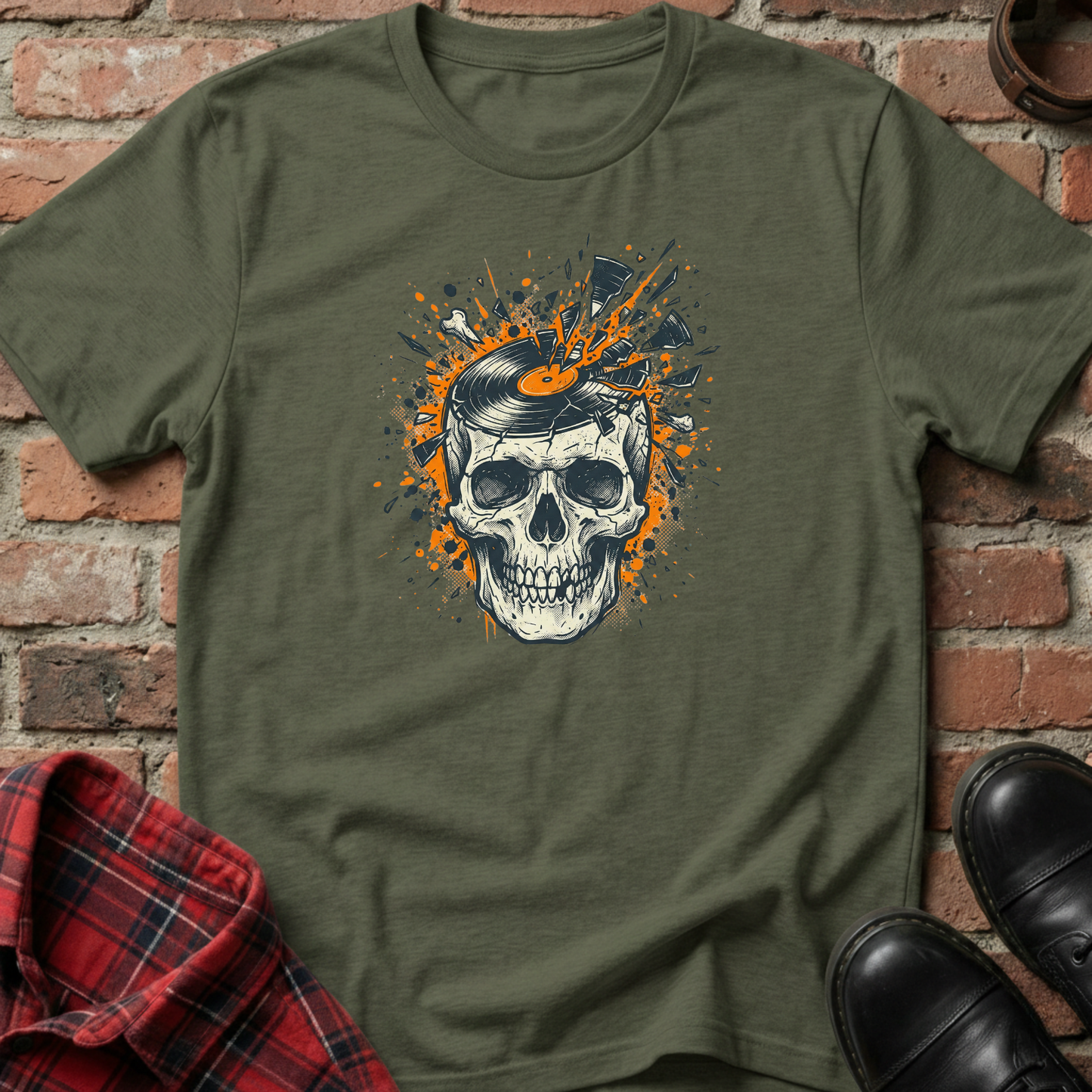 Green t-shirt with a skull design on a brick wall background. Minimalist music apparel by pemuyo.