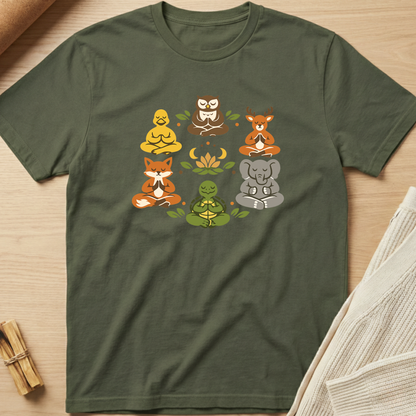 Green t-shirt with animal illustrations on a wooden surface. Minimalist yoga apparel by pemuyo.