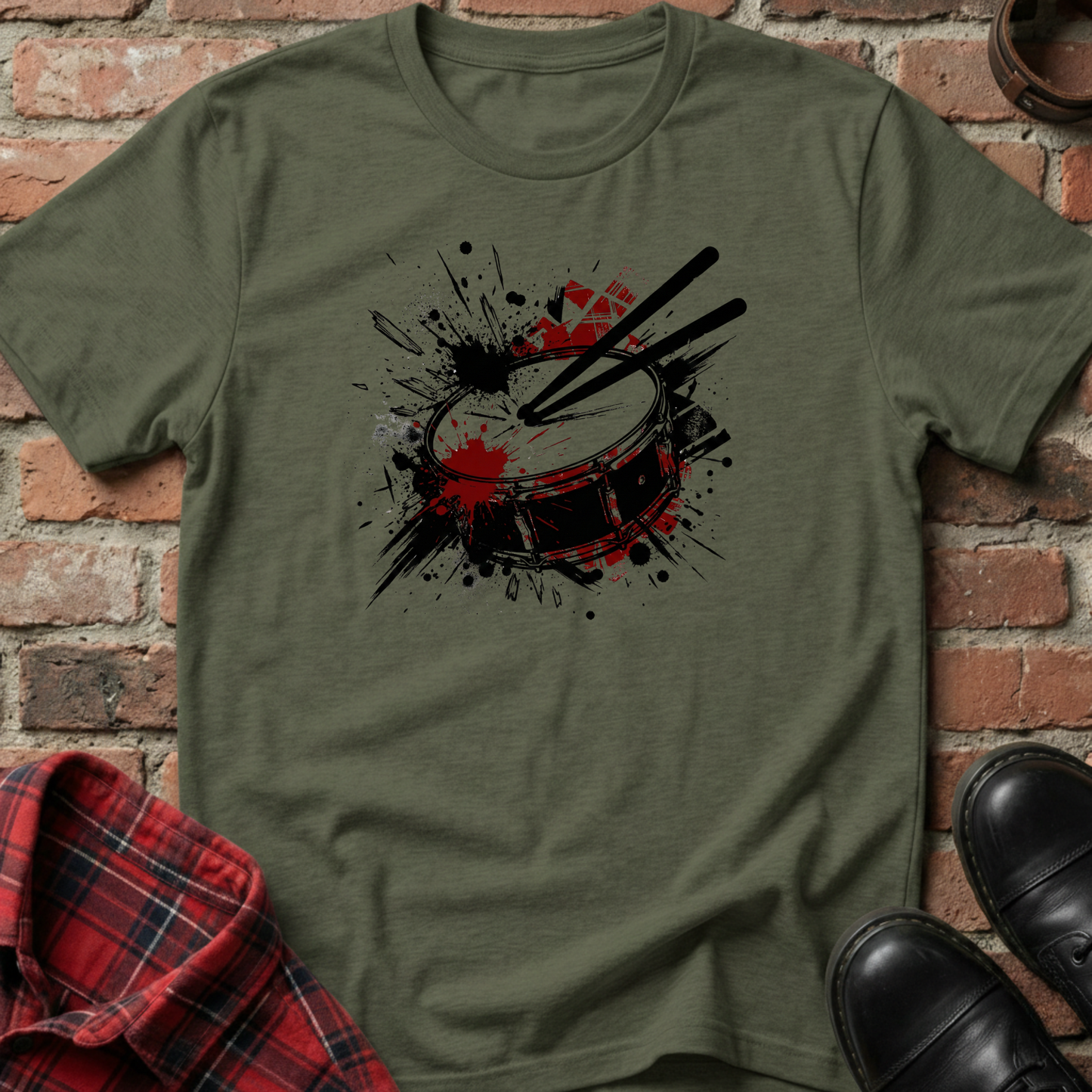 Green t-shirt with drum design on a brick background. Minimalist music apparel by pemuyo.