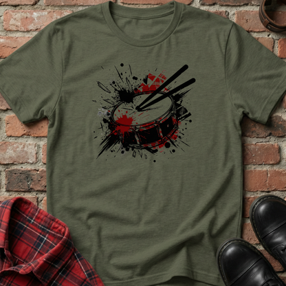 Green t-shirt with drum design on a brick background. Minimalist music apparel by pemuyo.