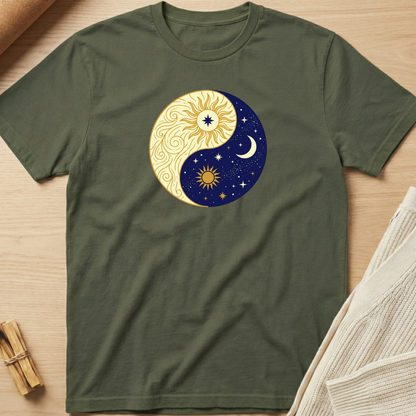 Green t-shirt with a yin yang design featuring celestial elements on a wooden surface. Minimalist yoga apparel by pemuyo.