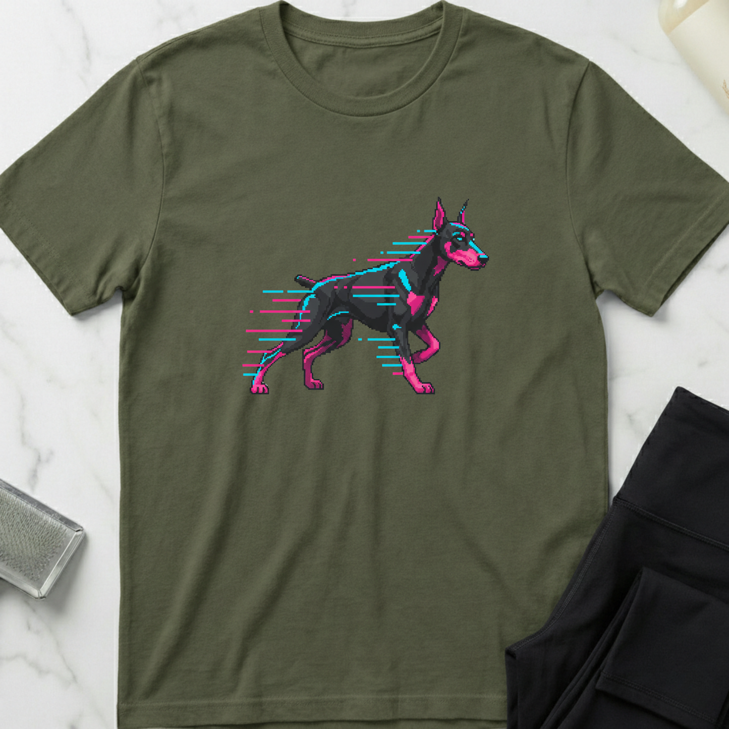 Green t-shirt with a stylized dog graphic on a marble surface. Minimalist dog apparel by pemuyo.