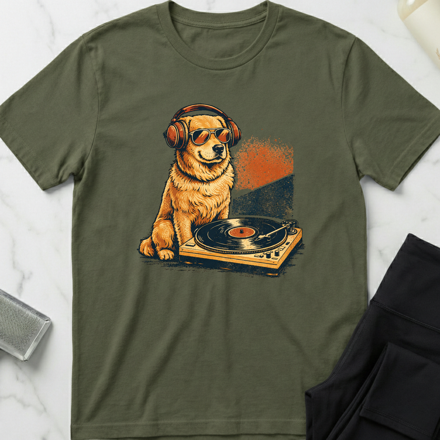 Green t-shirt with a dog wearing headphones and sunglasses on a turntable graphic. Minimalist dog apparel by pemuyo.