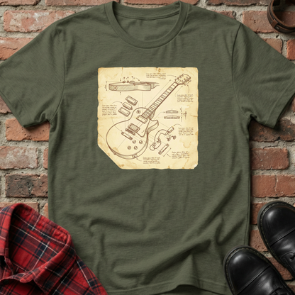 Green t-shirt with guitar blueprint design on a brick background. Minimalist music apparel by pemuyo.