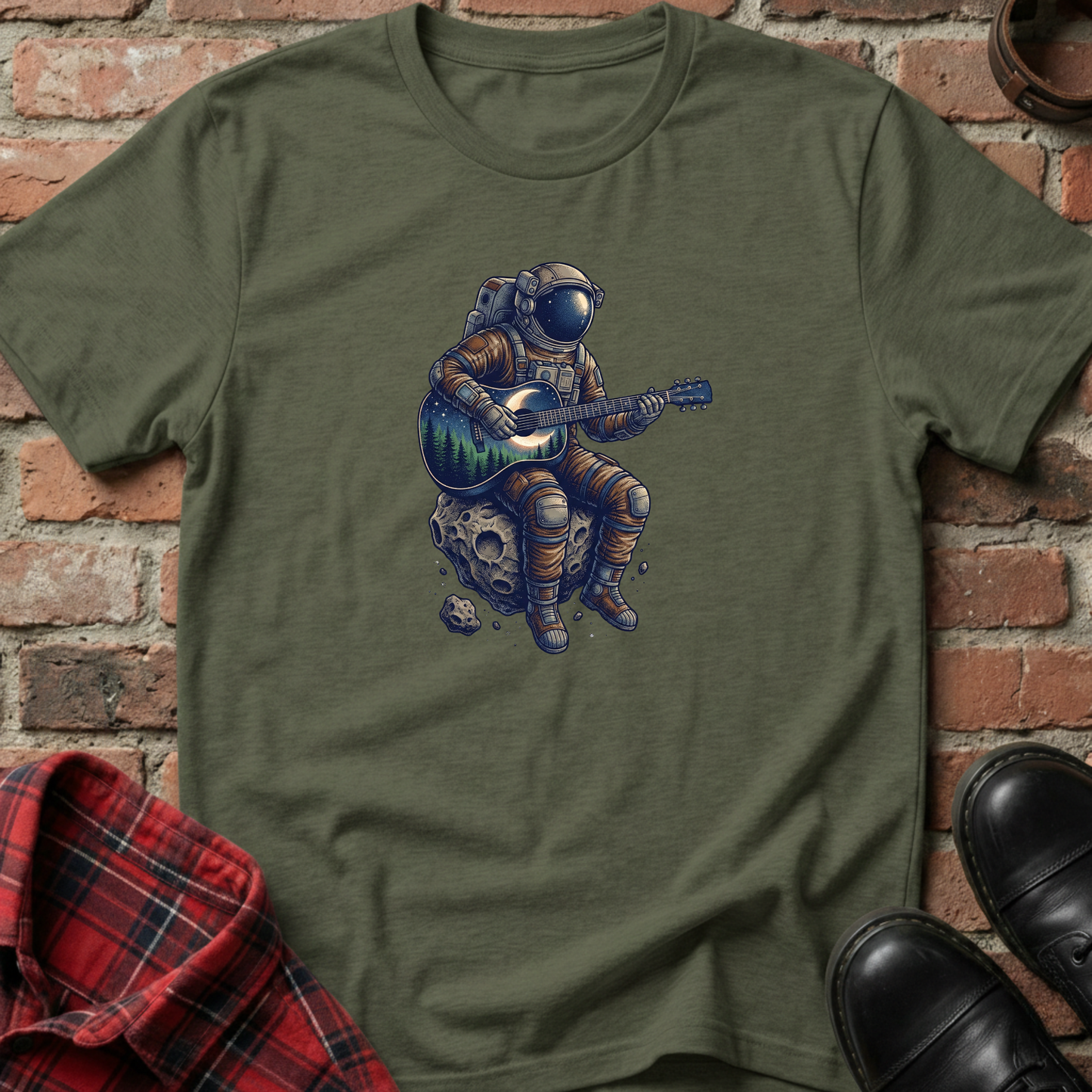 Green t-shirt with an astronaut playing guitar design against a brick wall. Minimalist music apparel by pemuyo.