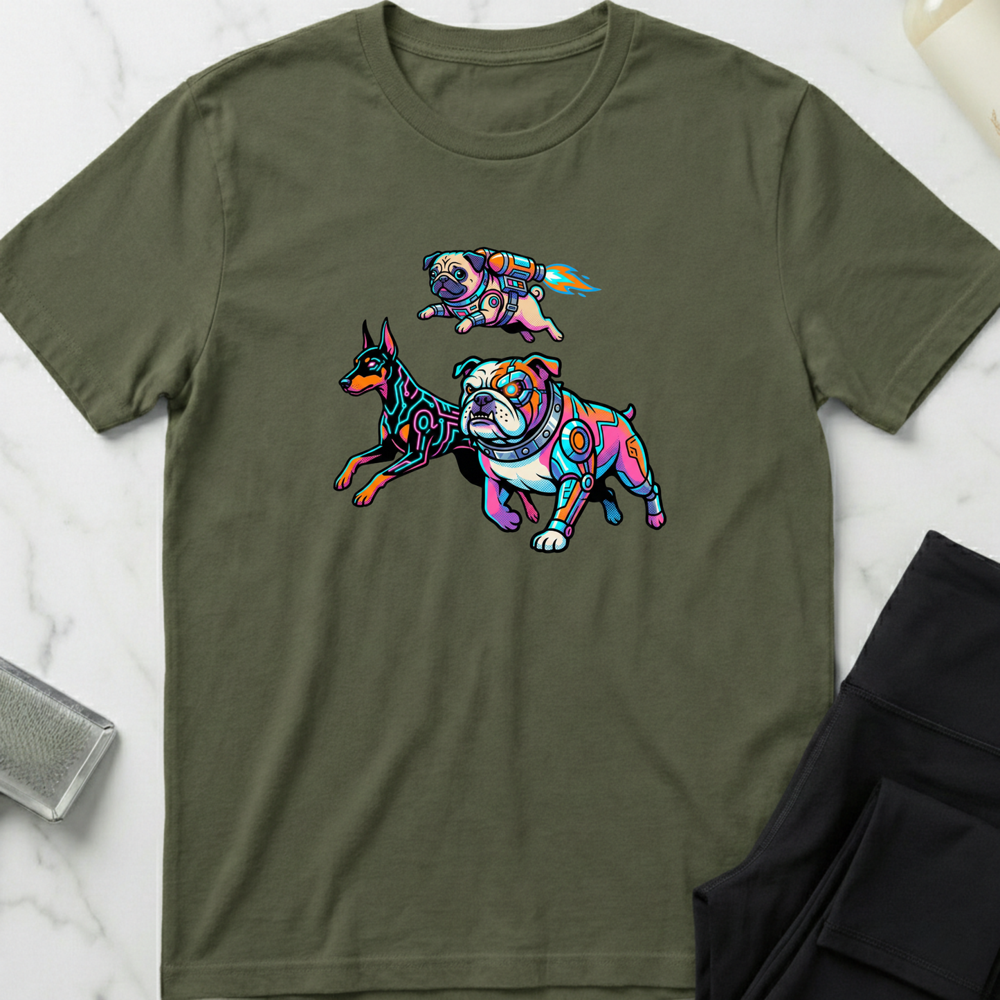 Green t-shirt with colorful dog illustrations on a white marble surface. Minimalist dog apparel by pemuyo.