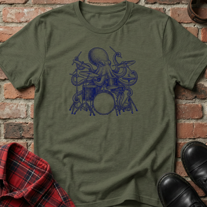 Green t-shirt with blue octopus playing drums graphic on a brick background. Minimalist music apparel by pemuyo.