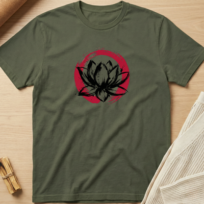 Green t-shirt with black lotus flower design on a wooden surface. Minimalist yoga apparel by pemuyo.
