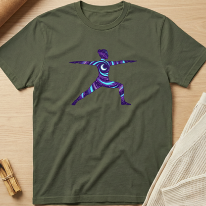 Green t-shirt with a colorful abstract design on a wooden surface. Minimalist yoga apparel by pemuyo.