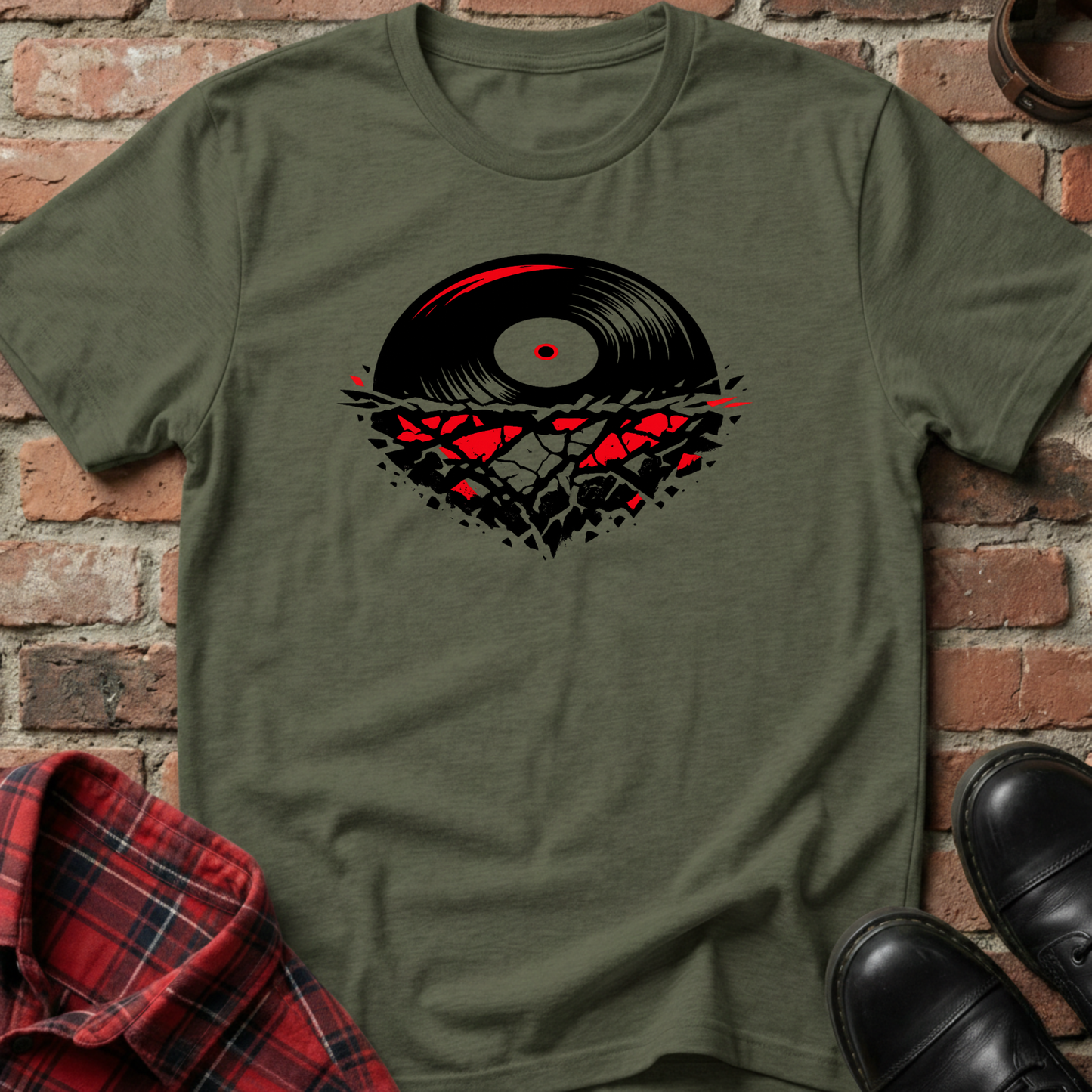 Green t-shirt with a vinyl record design on a brick wall background. Minimalist music apparel by pemuyo.