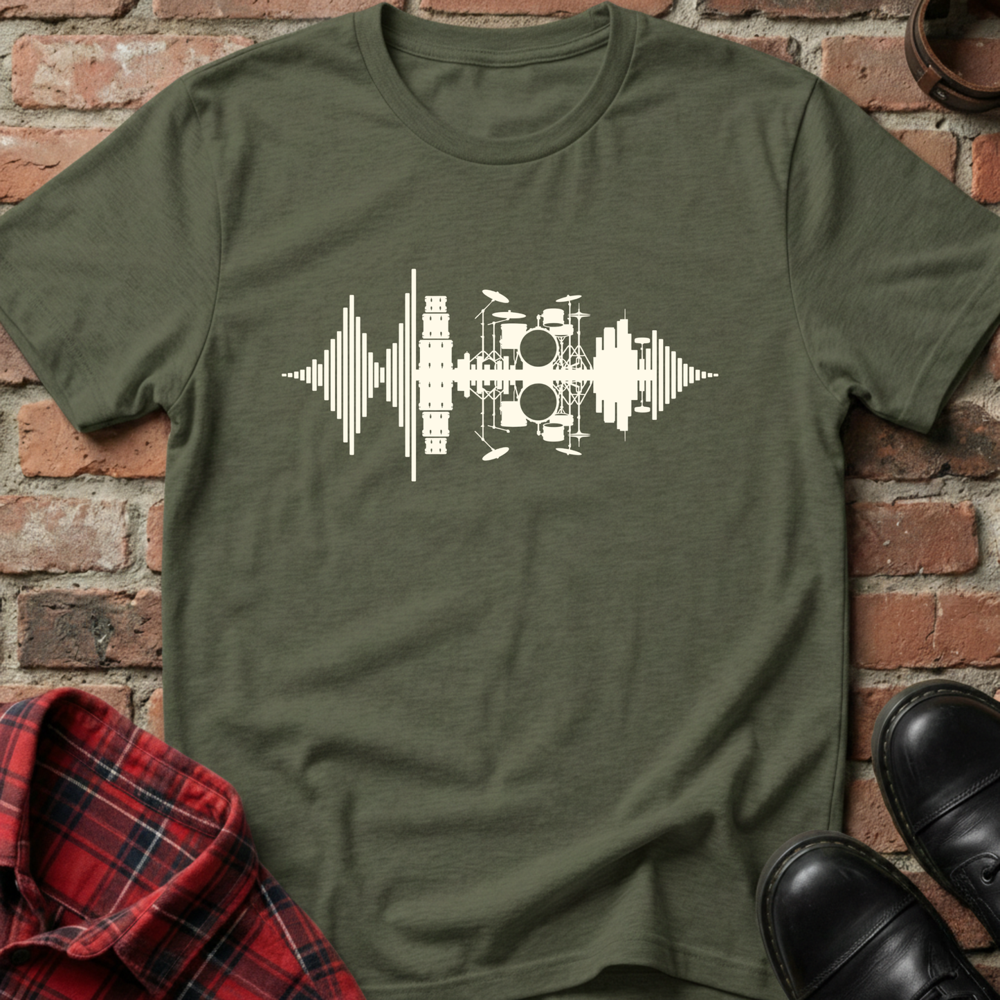 Green t-shirt with a white graphic design on a brick background. Minimalist music apparel by pemuyo.