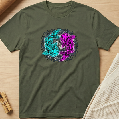 Green t-shirt with a colorful koi design on a wooden surface