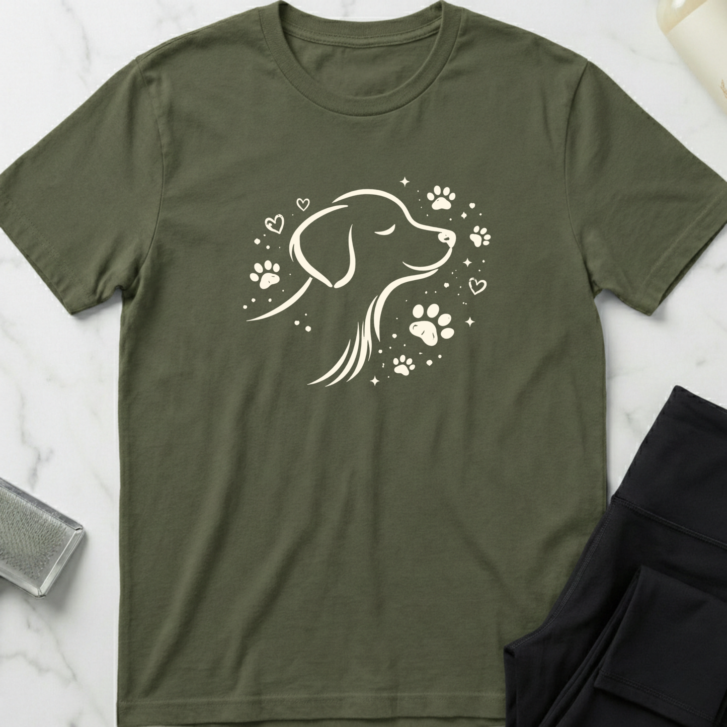 Green t-shirt with a dog illustration on a marble surface. Minimalist dog apparel by pemuyo.
