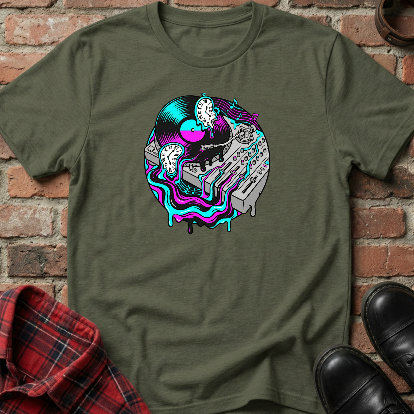 Green t-shirt with a colorful graphic design on a brick wall background. Minimalist music apparel by pemuyo.