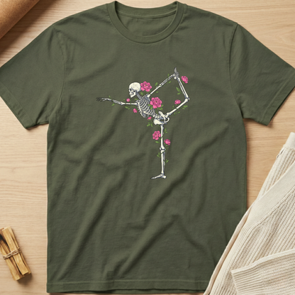 Green t-shirt with a skeleton and floral design on a wooden surface. Minimalist yoga apparel by pemuyo.