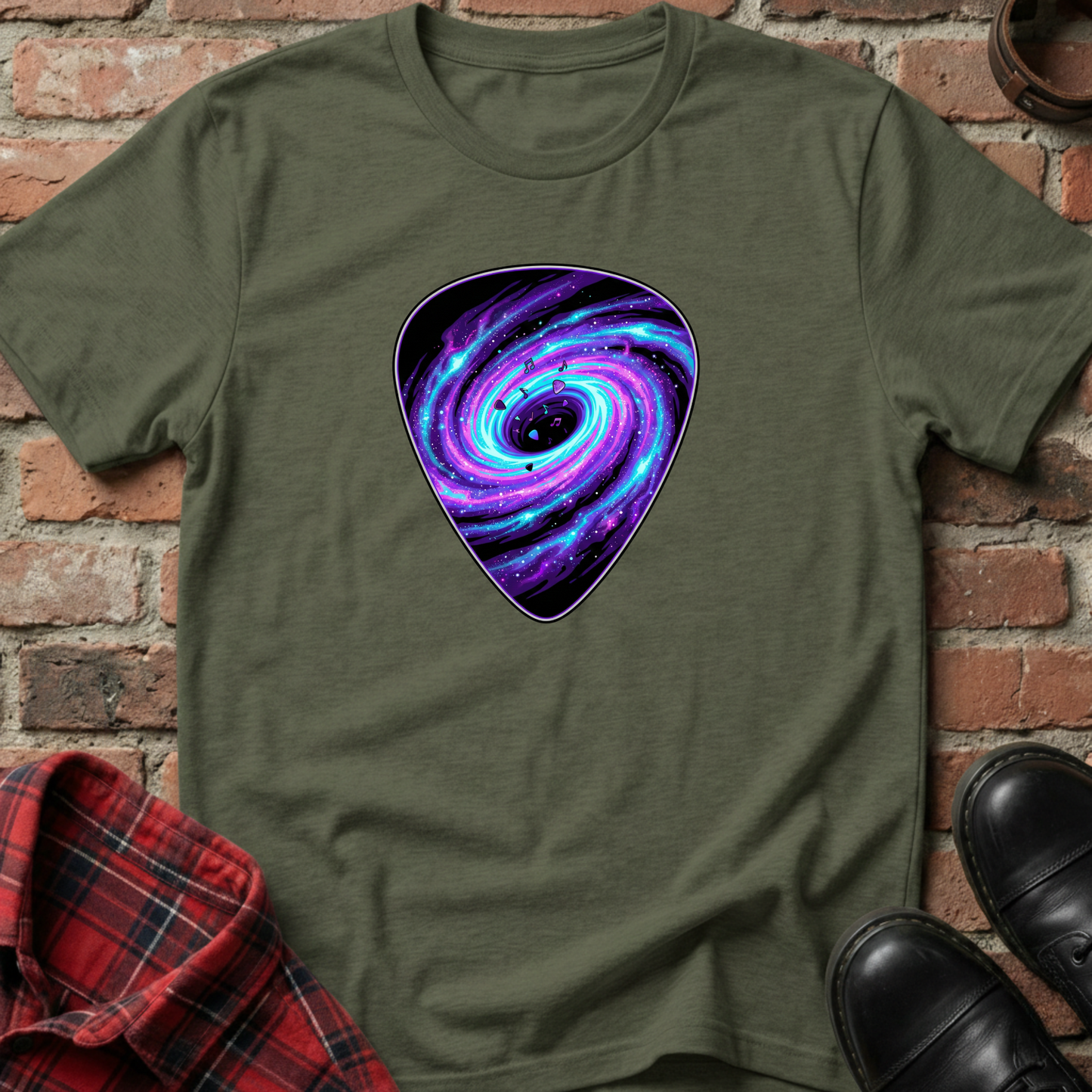 Green t-shirt with a purple and blue galaxy design on a brick background. Minimalist music apparel by pemuyo.